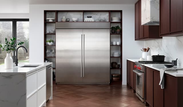 Front view of a modern kitchen with a large Sub-Zero refrigerator Front view of a modern kitchen with a large Sub-Zero refrigerator